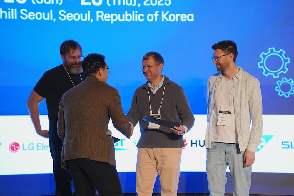 Denys Poshyvanyk receives an award for Most Influential Paper at the 2025 ACM/IEEE Automated Software Engineering conference in Seoul, South Korea. 
