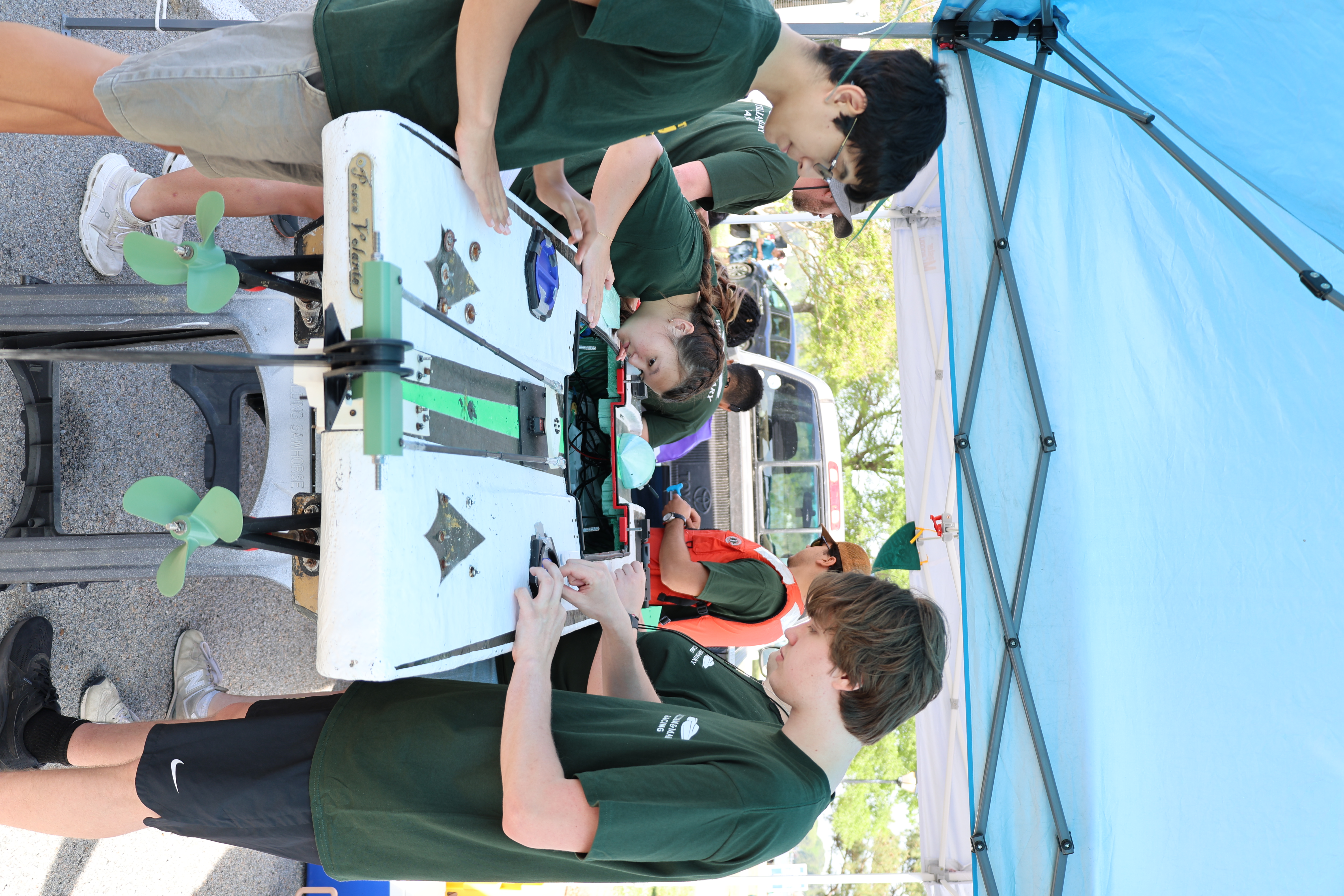 Team members prepare the boat prior to the race. 